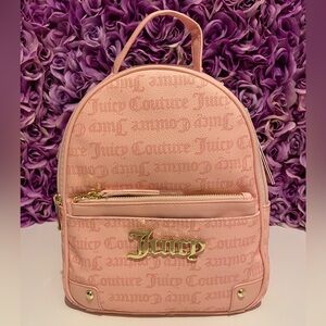 Light pink Juicy Couture back pack with small zippered pouch.